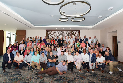 Sales staff and leaders at a sales meeting