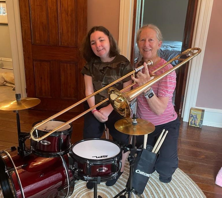 Our team member, Kathleen, joining a client in a jam session. We love to join in our clients' interests and fun. 