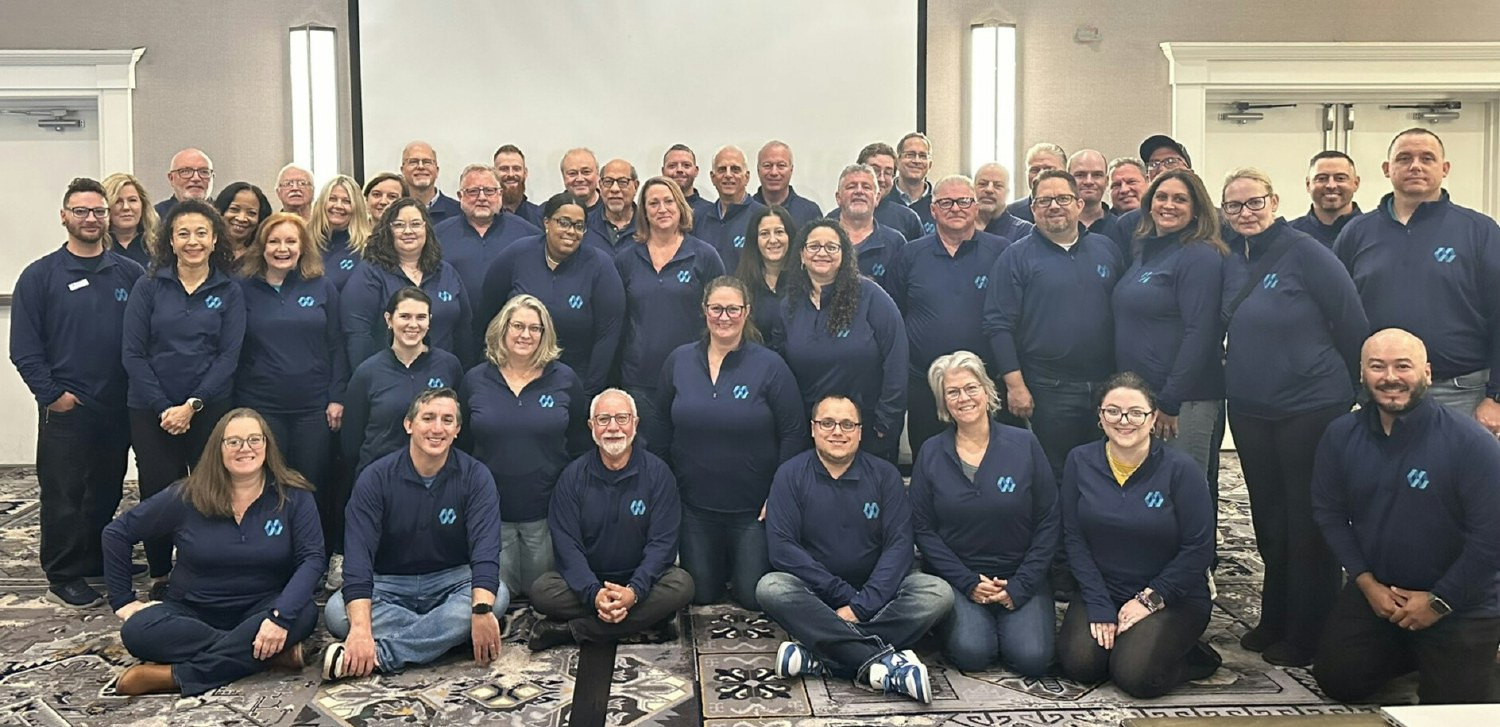 Group shot of company in our logo sweatshirts