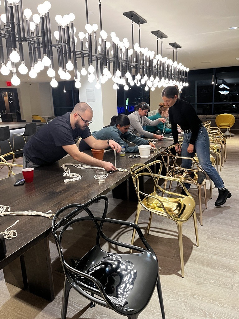 Employees who utilize WeWork space participating in a relaxing craft!