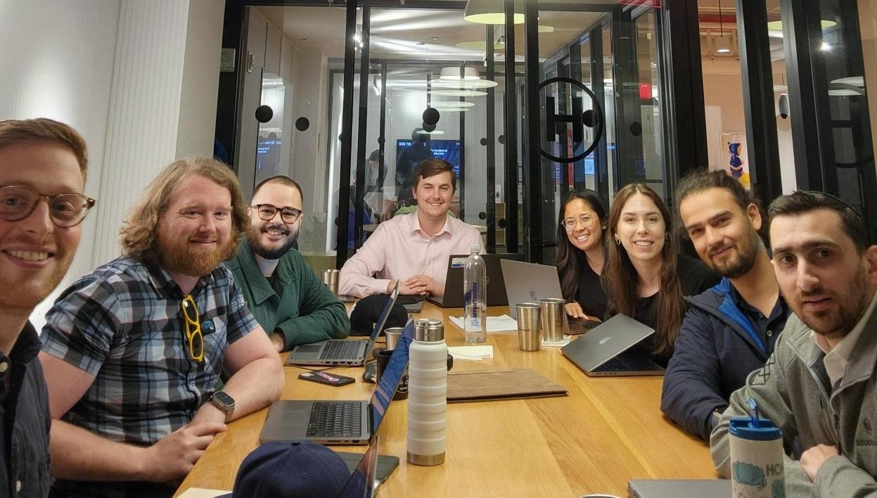 Team members gathering at a WeWork for Marketing departments offsite!