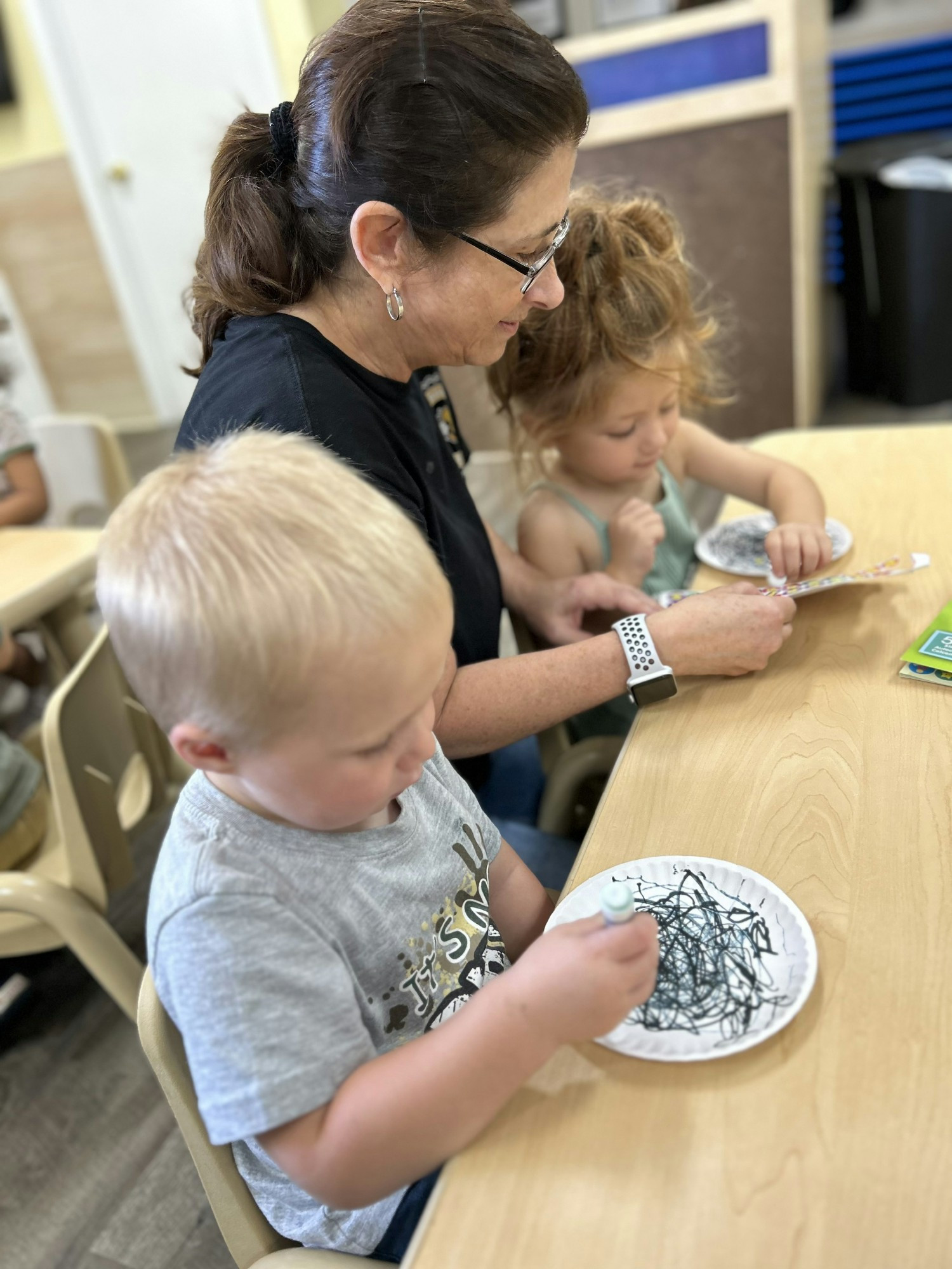 Focused learning: Our dedicated teacher guides tiny hands in creative activities, sparking curiosity and joy.