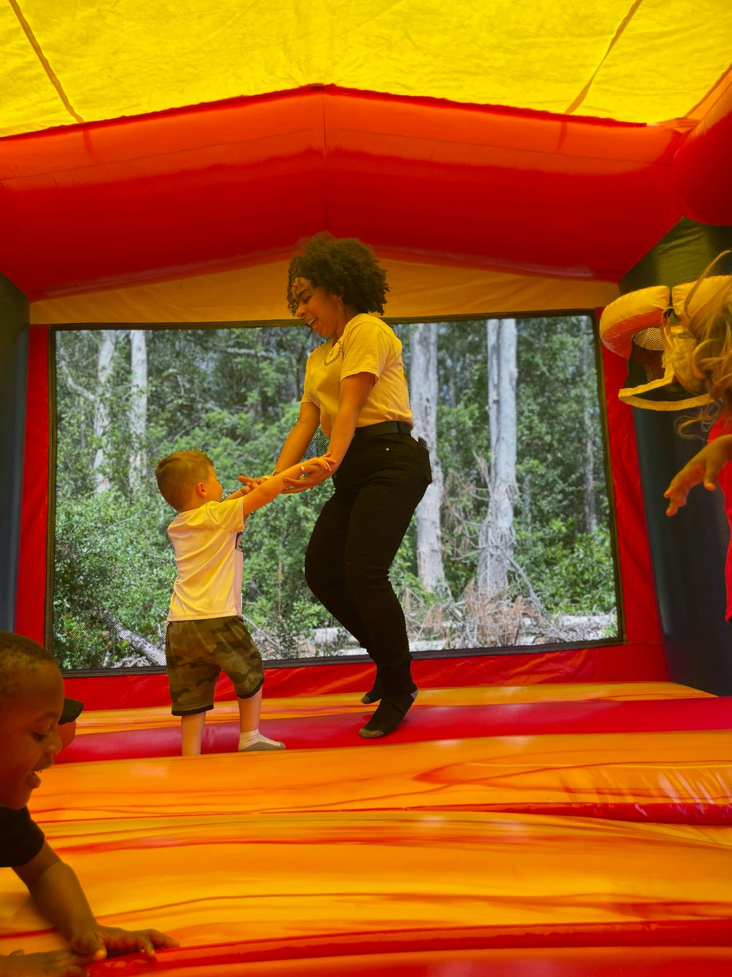 Joyful play in our bounce house—where care meets laughter and vibrant childhood moments!