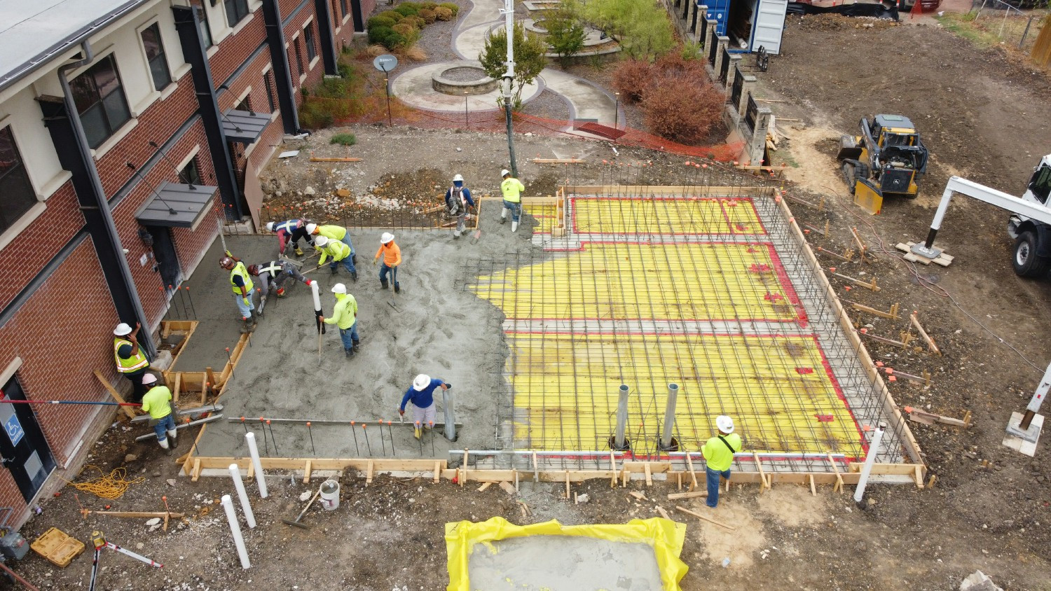 Falkenberg employees expertly handling a concrete pour on the jobsite.