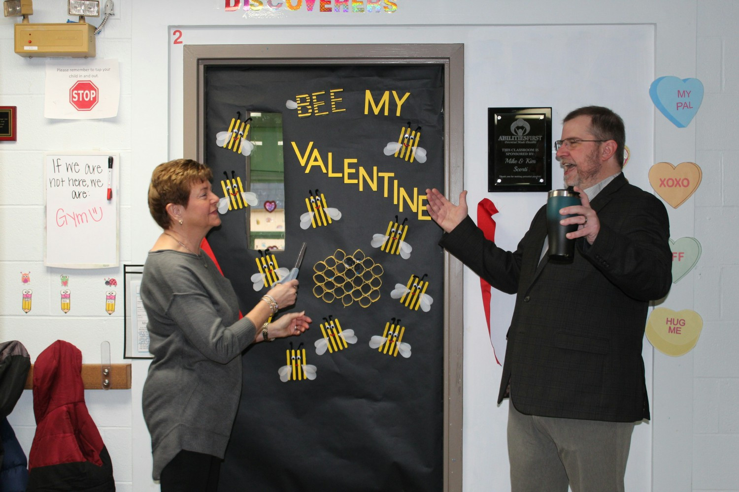 Abilities First Executive Director, David Hood, with a classroom sponsor at her ribbon cutting event.