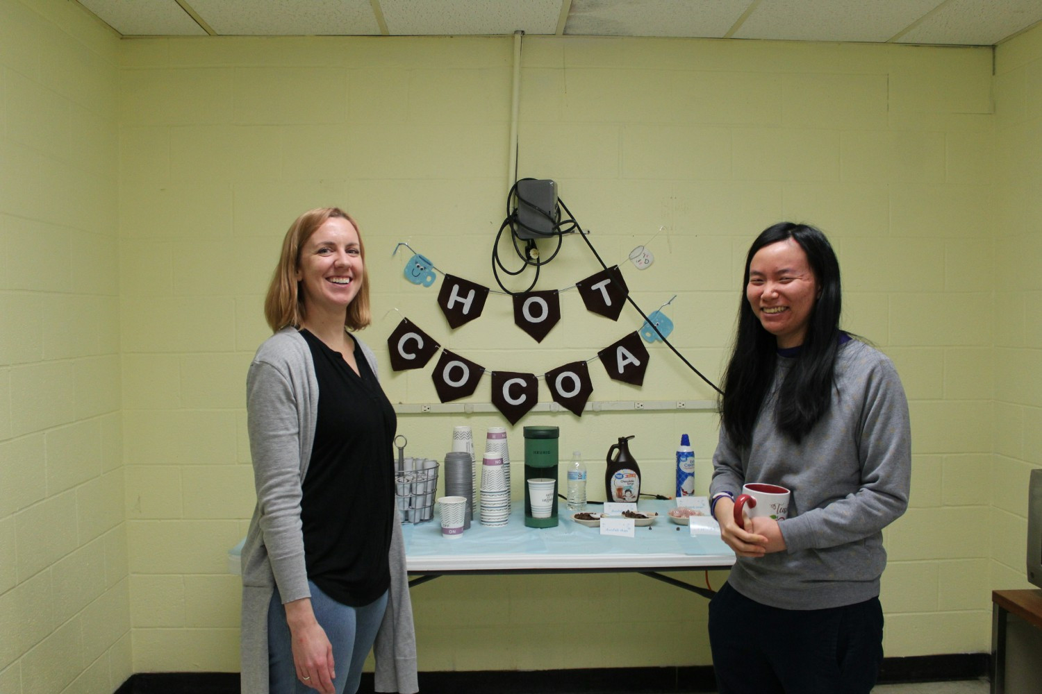 Staff enjoying a complimentary hot chocolate bar on National Hot Cocoa Day.