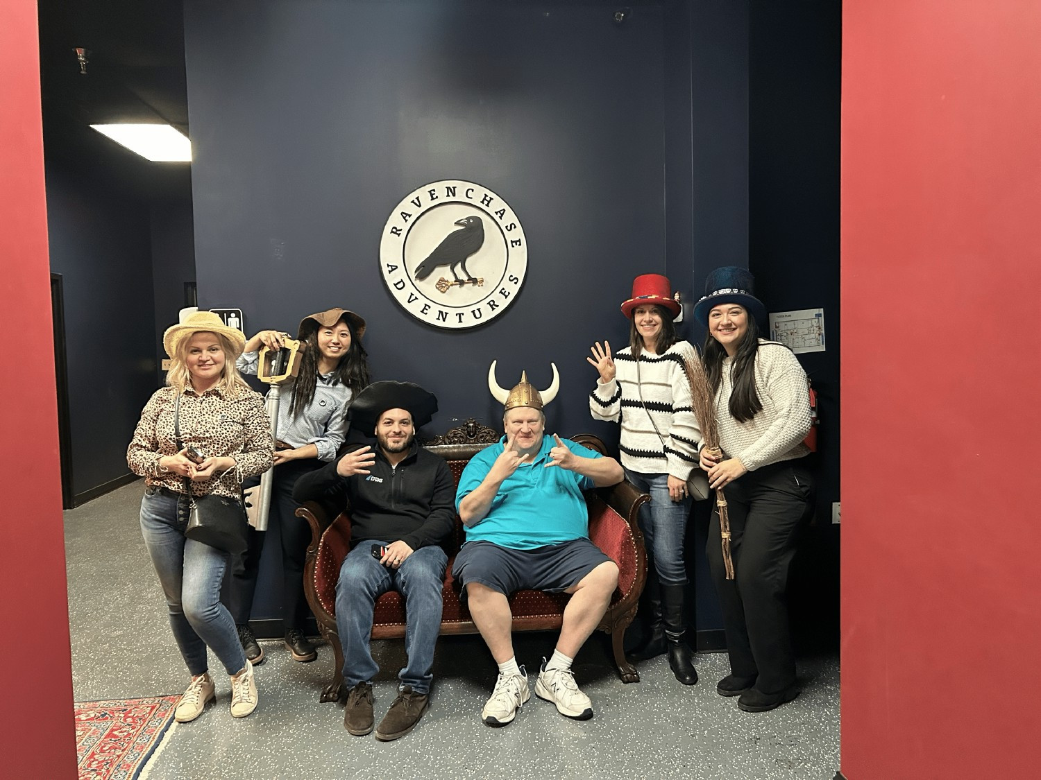 Escape room team bonding with funny costumes.